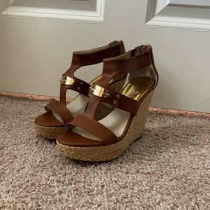 Brown Michael Kors leather wedge sandals with gold accents